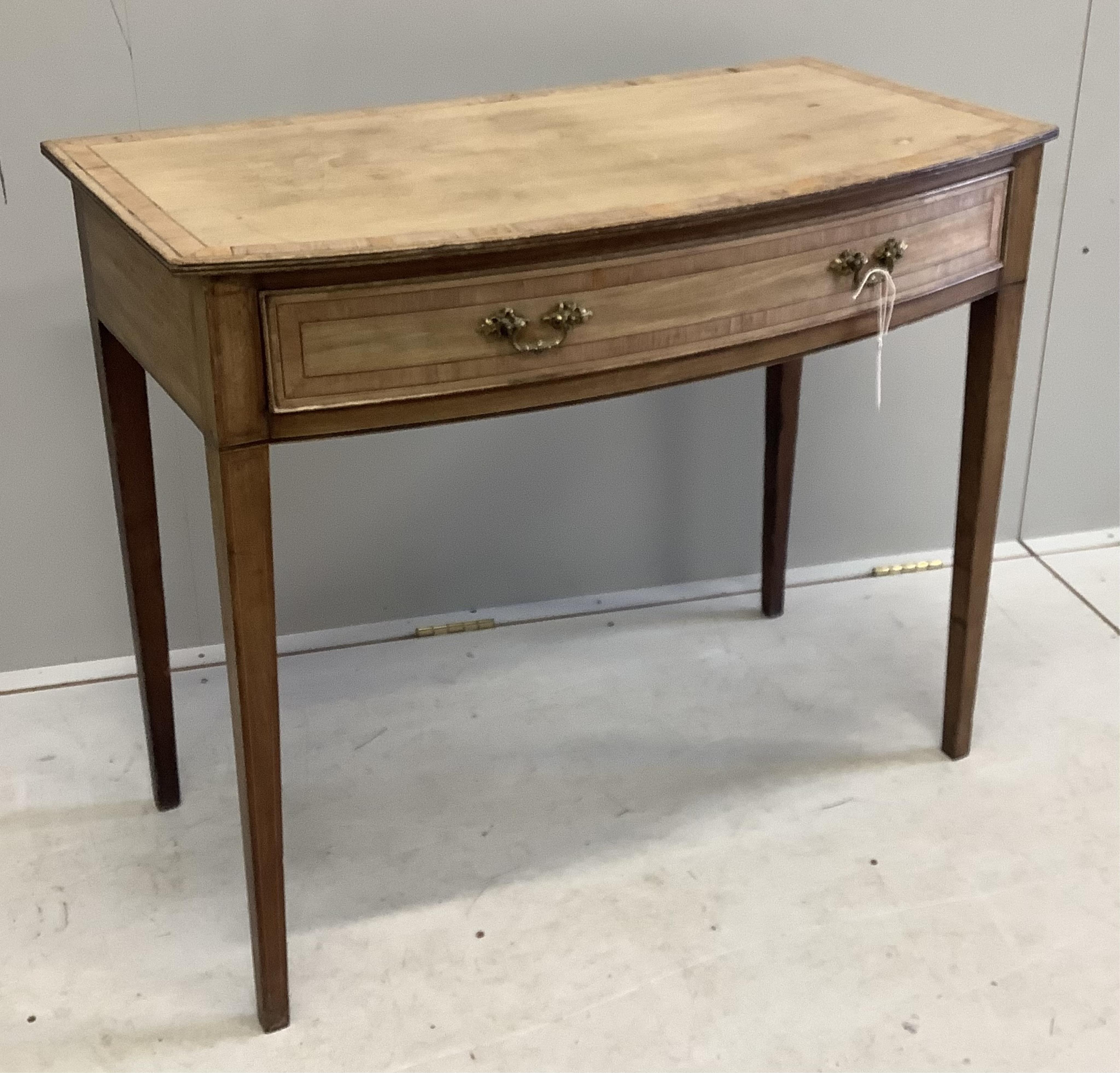 A George III faded banded mahogany bowfront side table, width 91cm, depth 49cm, height 76cm. Condition - poor to fair